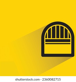 arch window with shadow on yellow background