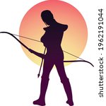 Archer standing with his bow. Archer preparing to shoot. Archer standing in front of sunset.