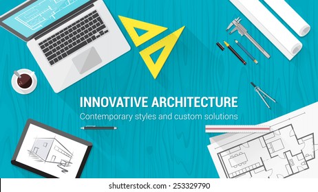 Architect desktop with tools including laptop, tablet and building plan