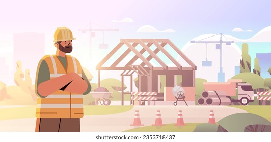 architect or engineer in uniform standing near unfinished building construction site background