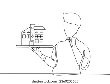 An architect holds a model of a house in his hands. Housing Day. World Architecture Day. One line drawing for different uses. Vector illustration.