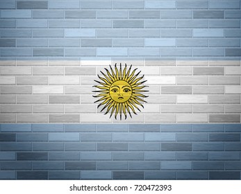 Argentina flag on textured brick wall.