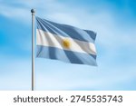 Argentina flag waving on pole against clear sky background.