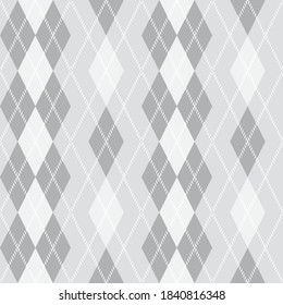 Argyle pattern seamless composed of diamonds of various colors on a plain background, used in knitted garments such as sweaters and socks. Fabric texture background. Vector.