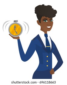 Arican-american stewardess showing ringing alarm clock. Young stewardess with alarm clock. Happy stewardess holding alarm clock. Vector flat design illustration isolated on white background.