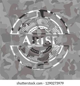 Arise written on a grey camouflage texture