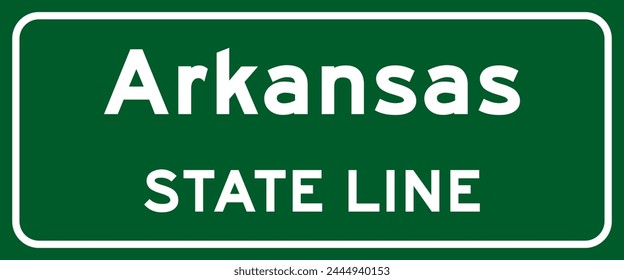 Arkansas state line road sign, white letters on green background