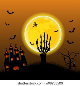 arm bone held above grave with full moon and dark castle on halloween party.