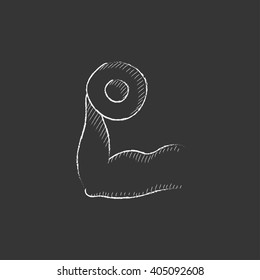 Arm with dumbbell. Drawn in chalk icon.