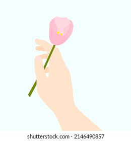 Arm with flower on white background. Nature concept. Spring card.