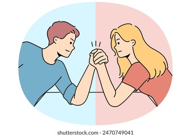 Arm wrestling between couple of man and woman for concept of fighting for leadership in family. Guy with girl compete who is stronger competing for position in company or leadership in team