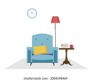 An armchair, a floor lamp and a round table with books. Cozy interior. Place to rest 