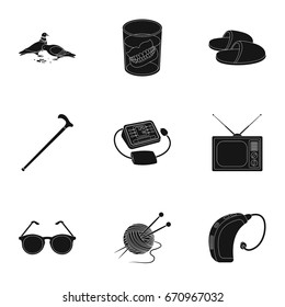 Armchair, slippers, tonometer and other attributes of old age.Old age set collection icons in black style vector symbol stock illustration web.