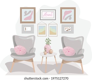 armchairs with cushions, paintings on the wall and flowers in a vase