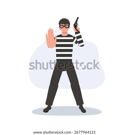 armed burglar standing with weapon and raised hand masked bandit. robbery crime