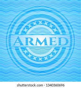 Armed light blue water wave badge.