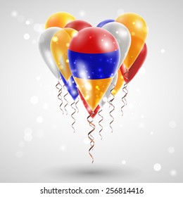 Armenian flag on air balls in heart-shaped. Celebration and gifts. Ribbon in the colors are twisted under the balloon. Independence Day. Balloons on the feast of the national