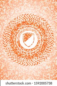 armor icon inside abstract orange mosaic emblem