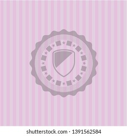 armor icon inside badge with pink background