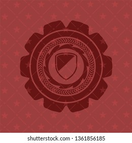 armor icon inside badge with red background