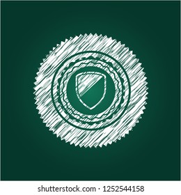 armor icon inside chalkboard emblem