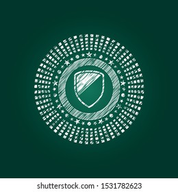 armor icon inside chalkboard emblem written on a blackboard