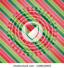armor icon inside christmas badge.