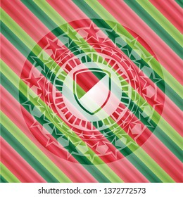 armor icon inside christmas badge.