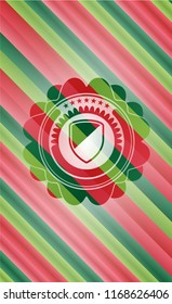 armor icon inside christmas style emblem.