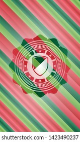 armor icon inside christmas style badge..