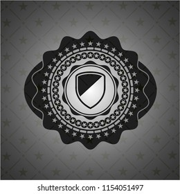 armor icon inside dark badge or emblem