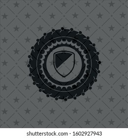 armor icon inside dark badge or emblem