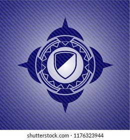 armor icon inside denim background