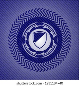 armor icon inside emblem with denim texture