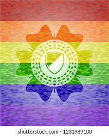 armor icon inside emblem on mosaic background with the colors of the LGBT flag
