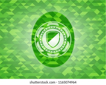 armor icon inside green emblem with mosaic background
