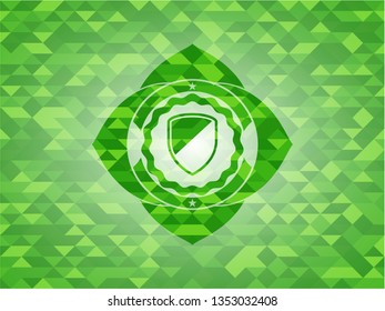 armor icon inside green mosaic emblem