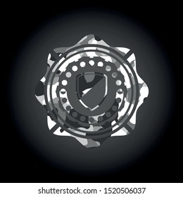 armor icon inside grey camouflage emblem