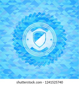 armor icon inside light blue mosaic emblem