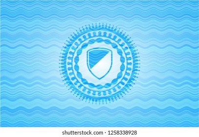 armor icon inside light blue water wave badge background.