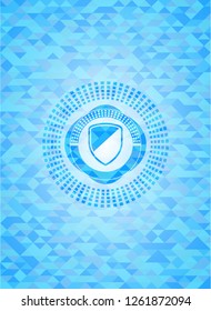 armor icon inside light blue emblem with triangle mosaic background