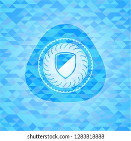 armor icon inside light blue emblem with mosaic background