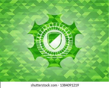 armor icon inside realistic green emblem. Mosaic background