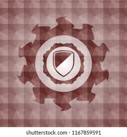 armor icon inside red seamless emblem or badge with abstract geometric pattern background.