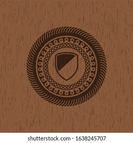 armor icon inside retro style wood emblem