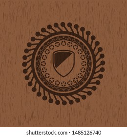 armor icon inside retro wooden emblem