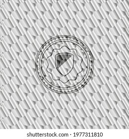 armor icon inside shiny silver emblem. Scales pattern. Vector Illustration. Detailed. 