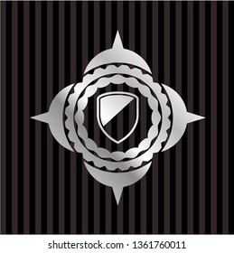 armor icon inside silver badge or emblem
