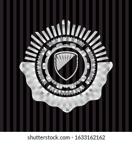 armor icon inside silver emblem or badge