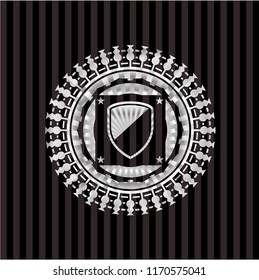 armor icon inside silvery emblem or badge
